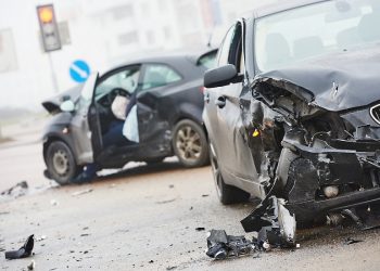 car crash accident on street, damaged automobiles after collision in city